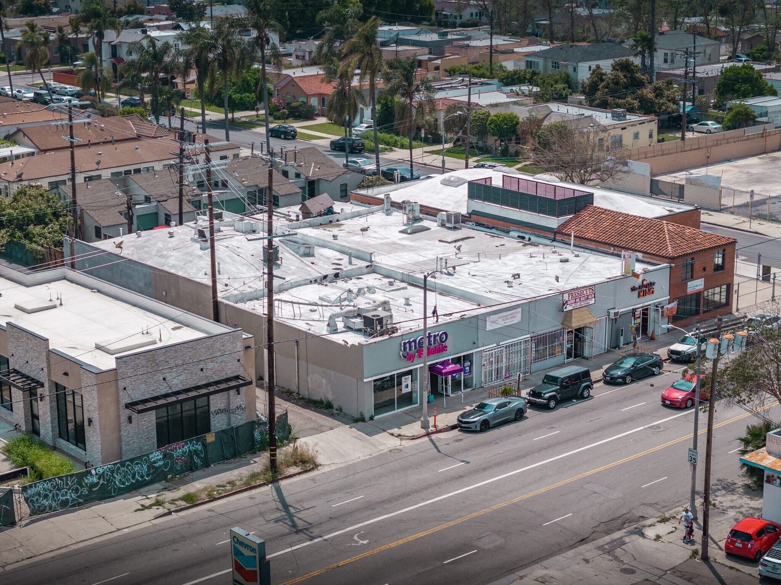 Aerial view of the property on W Jefferson Blvd and the surrounding neighborhood, Los Angeles.